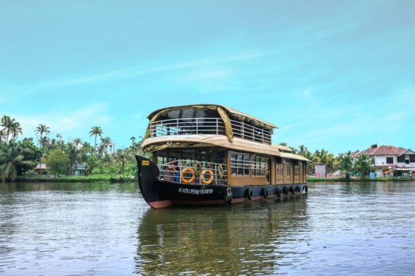 Alleppey boathouse cruising through Kerala backwaters offering traditional houseboat experience