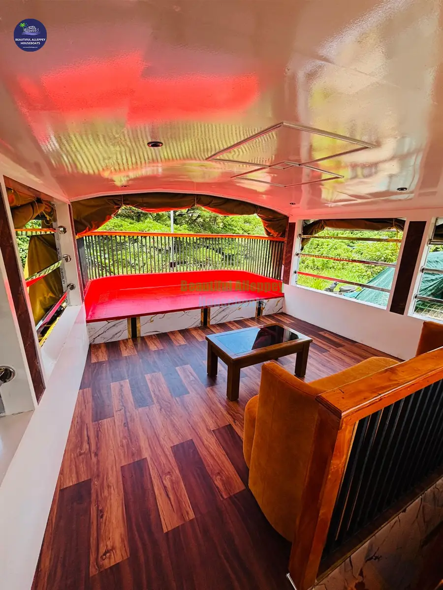 Upper Deck View Lounge for Couples Open upper deck lounge with plush seating overlooking the Kerala backwaters