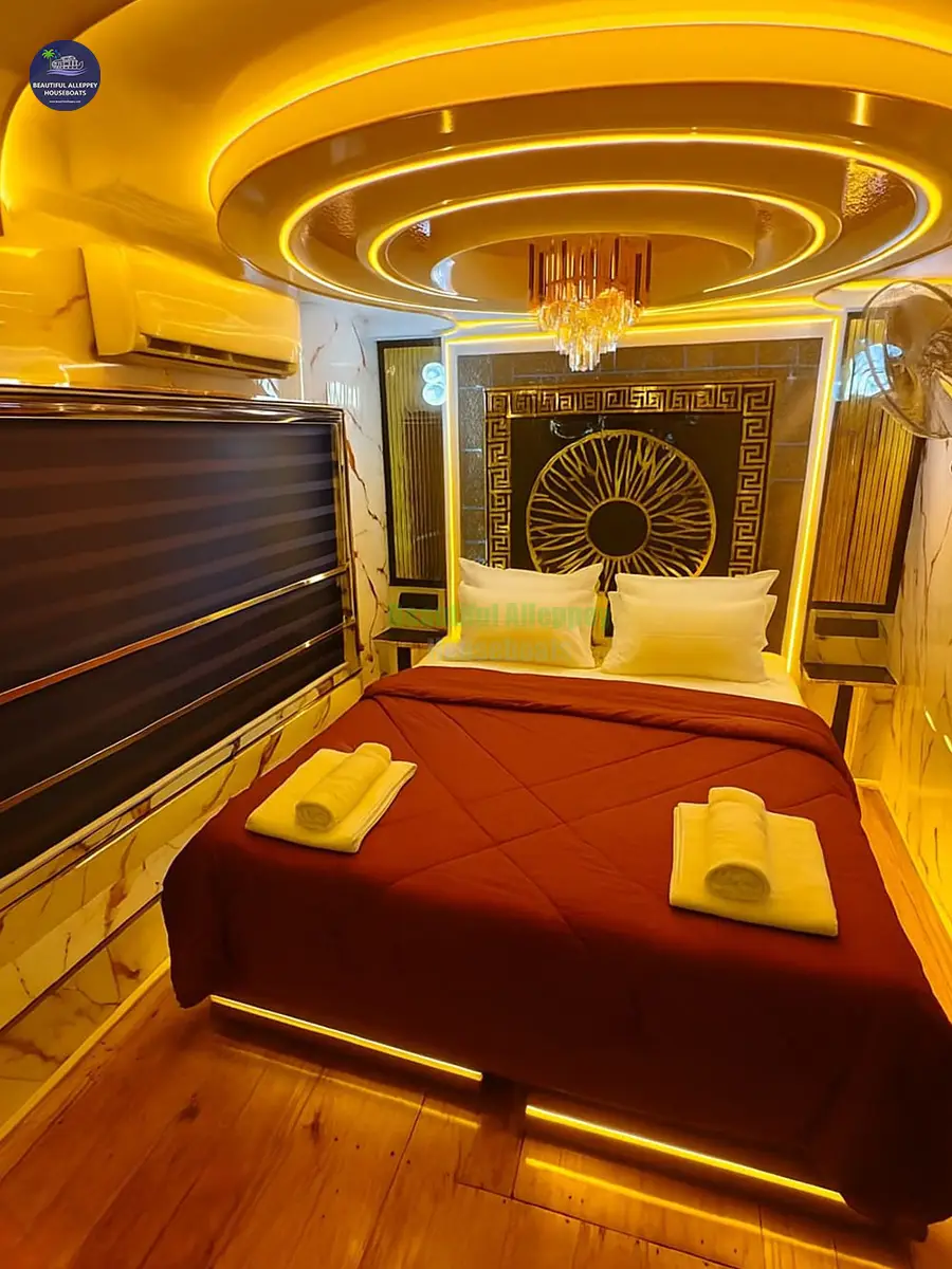 Premium Honeymoon Houseboat Bedroom Interior Air-conditioned premium bedroom with ambient lighting inside a 1-bedroom Alleppey houseboat