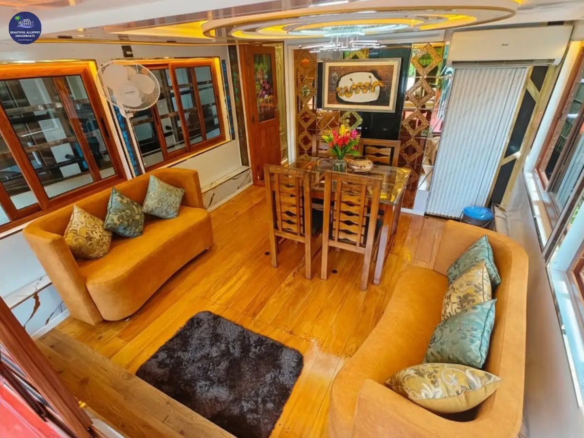 Panoramic Glass-Encased Dining Space Cozy dining space with floor-to-ceiling glass windows offering backwater views