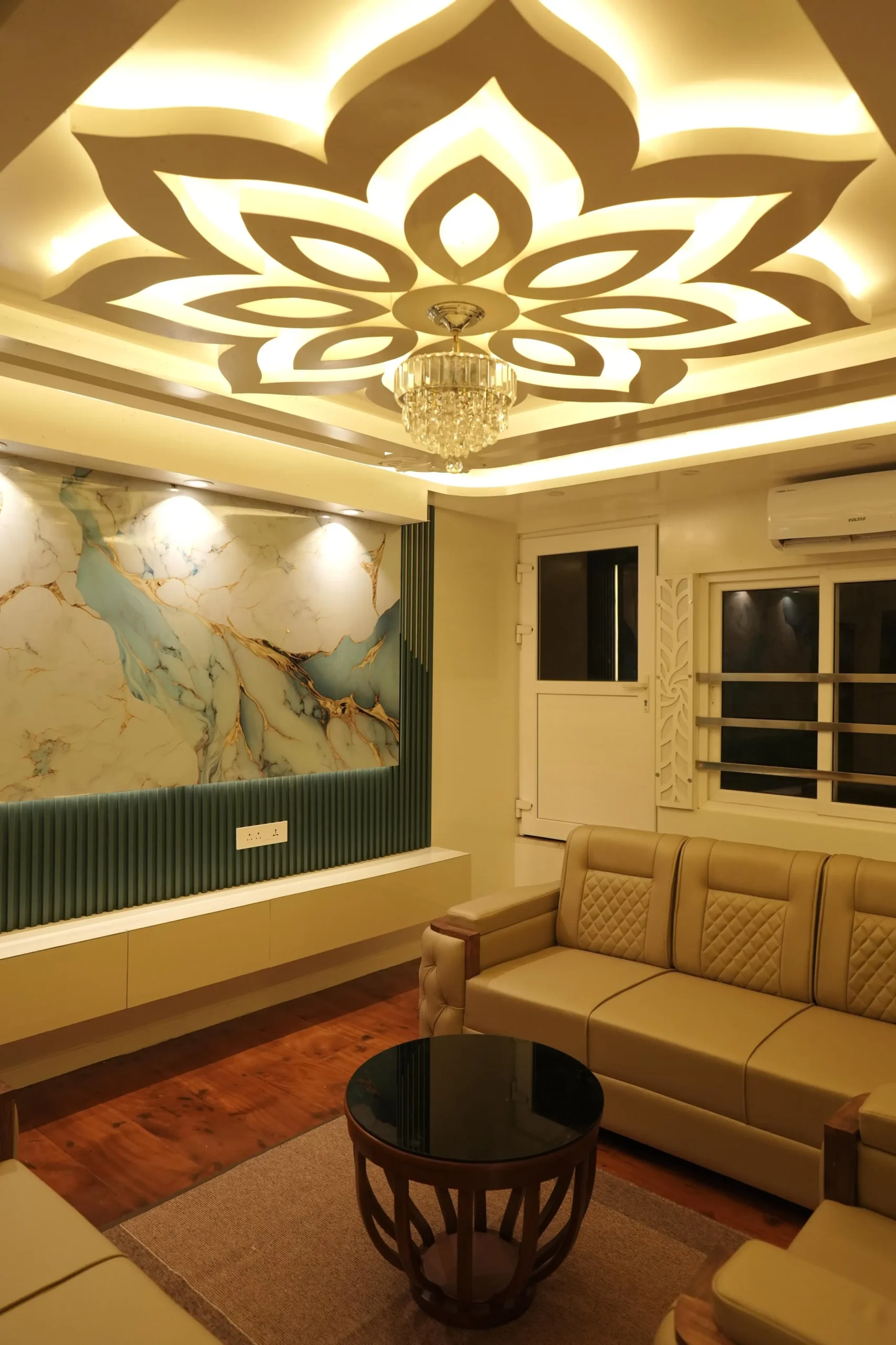Lower Deck Glass Salon & Sitting Lounge View Wide interior view of the spacious front lounge sitting area with sofas and glass windows on a 5 bedroom Alleppey houseboat.