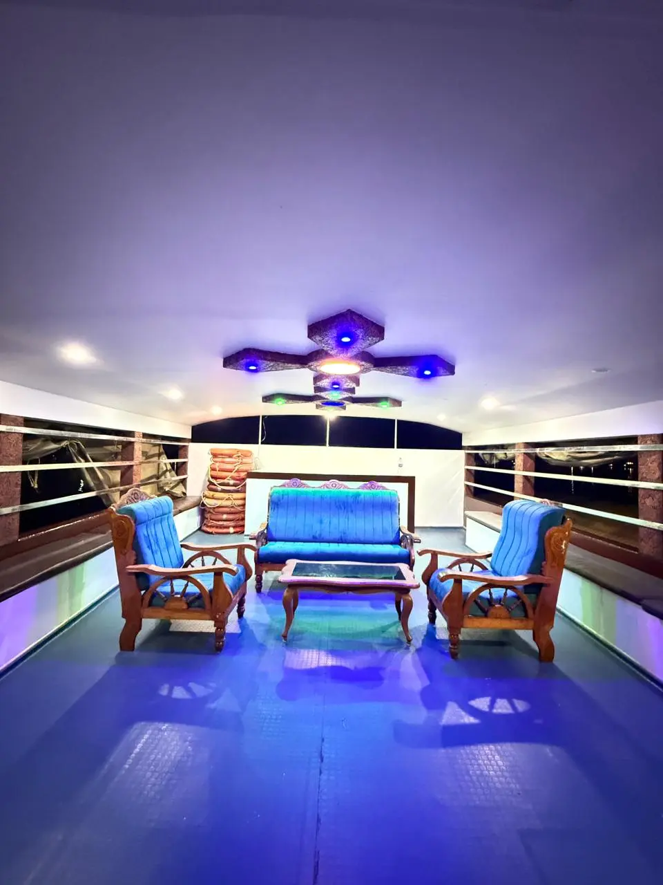 mithtam-mithram02-open-upper-deck-sofa-seating Open upper deck on Mithtam houseboat featuring classic plush sofa seating overlooking Alleppey backwaters.